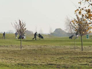 Golfers from the holiday home balcony