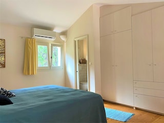 Bedroom with large built-in wardrobe