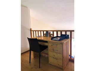 Small writing desk in the bedroom area