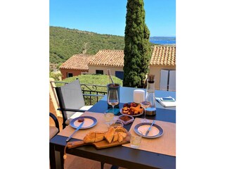 Sunny terrace with sea view over the stunning bay