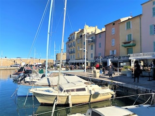 Saint-Tropez harbor bay with joyful restaurants