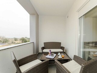 Roofed and furnished balcony