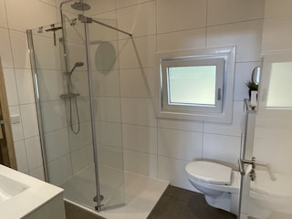 open shower with rainfall showerhead