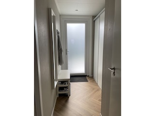 Front entrance with coat area and built-in closets