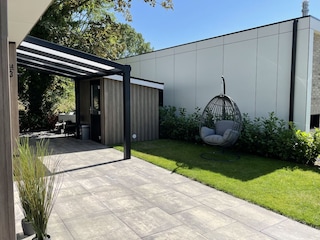 Entrance area with hanging wicker chair