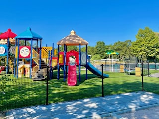 Play tower at the outdoor pool with a football field