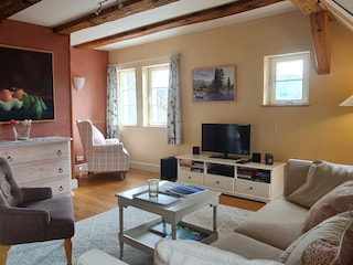 bright  living area with views across lake