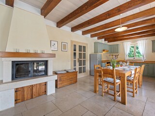 Kitchen and dining area with an entrance to the terrace
