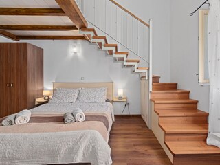 Bedroom with the stairs to the gallery.