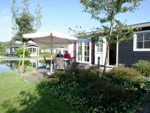 Holiday park Comfy chalet with a dishwasher, directly on a pond - Holten - image1