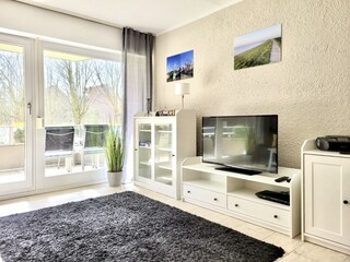 Wohnzimmer mit Zugang zur Loggia