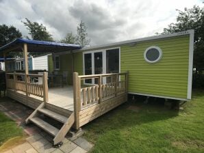 Holiday park Colorful chalet with veranda, located in Friesland - Sumar - image1