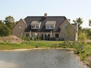 Ferienpark Amplio chalet con chimenea deco en Texel