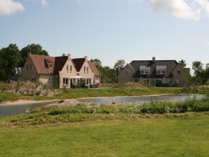 Ferienpark Amplia villa con chimenea decorativa en Texel
