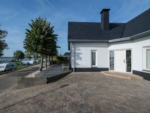 Holiday park Luxury villa with outdoor kitchen and lake view - Maurik - image1