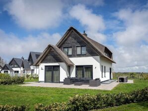 Parco vacanze Villa con tetto in paglia vicino al mare a Texel - Il Castello - image1