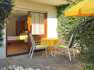 Terrace with seating and deck chairs