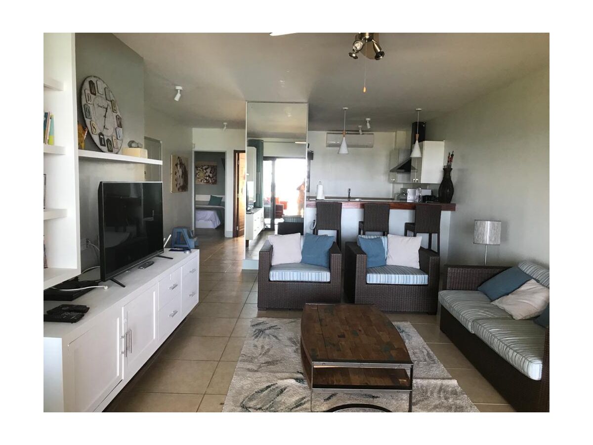 Living room with an American-style kitchen