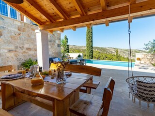 Covered outdoor dining area for 8 people.