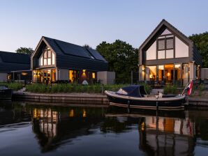 Ferienhaus Luxusvilla mit privater Terrasse am Wasser - Balk - image1