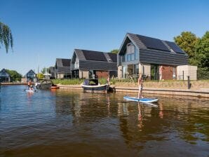 Ferienhaus Luxusvilla mit privater Terrasse am Wasser - Balk - image1