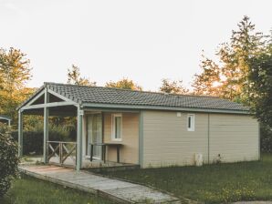 Holiday park Wooden chalet on the edge of a lake - Ménoire - image1