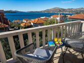 The small table and two chairs to enjoy a jus, and sea