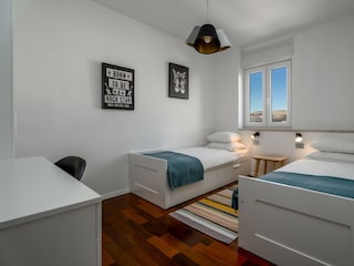 Bedroom No3 (11sqm) with two single beds 80cm x 200cm.