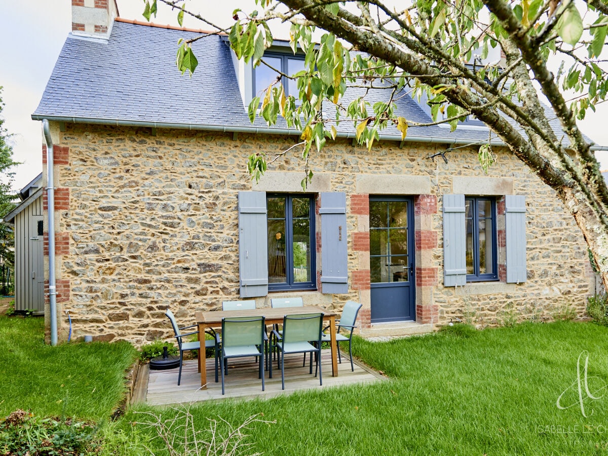 Facade of the house with a sunny terrace