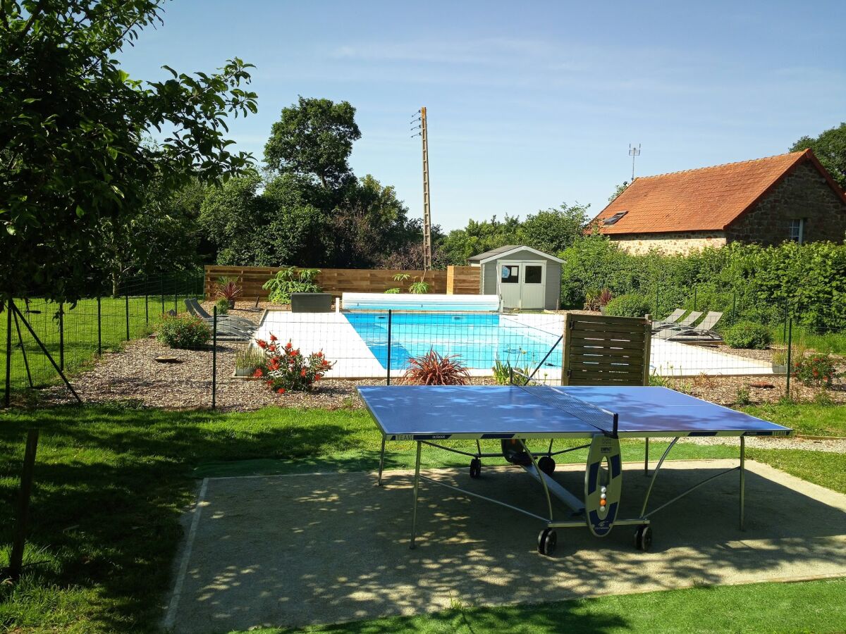 Table tennis next to the pool