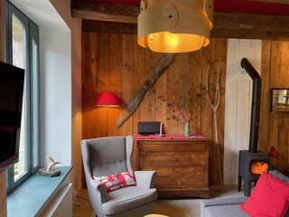 Living room of the Métairie with Scandinavian wood-burn