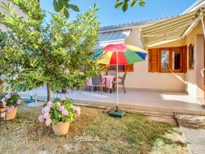 Ferienhaus MELITA cozy Terrasse und großem Garten