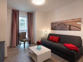 Gästezimmer mit Luxus-Schlafcouch und TV