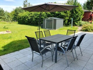 Relax on a private terrace, overlooking the garden
