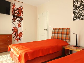 cozy (children's) bedroom with TV