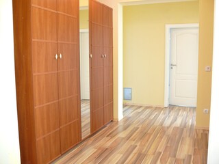 There is a large wardrobe in the hallway.