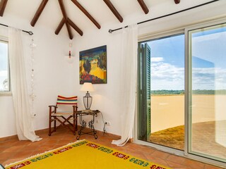 Schlafzimmer mit Zugang auf obere Terrasse