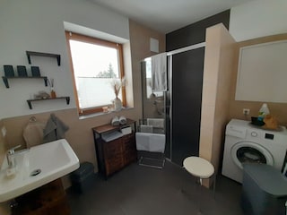 bathroom with washing machine