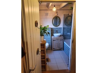 Bathroom with toilet, shower and bath