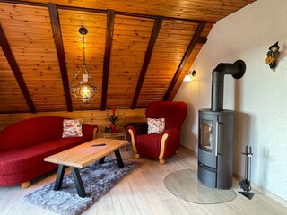 FeWo Hexe / 2 pers. / living area with fireplace