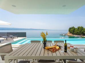 Villa Nina aan het strand met 5 slaapkamers en eigen badkamer