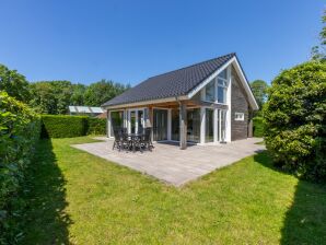 Holiday house Detached holiday home in a wooded area near the beach - Nieuw-Haamstede - image1