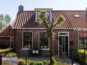 Weelderig vakantiehuis met tuin aan zee - Moddergat - image1