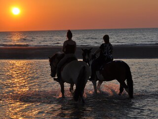Riding on the beach
