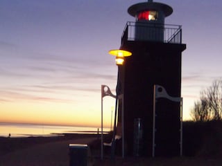 Sonnenuntergang mit Leuchturm und Blick nach Amrum.