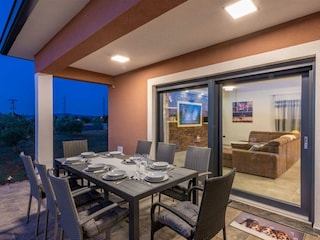 From morning breakfasts to twilight dinners, the covered terrace becomes your cherished sanctuary...