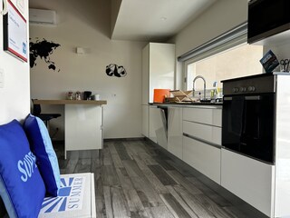 Kitchen with lake view in living area