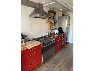 Offene Küche mit großen Gasherd/Elektrobaxkofen