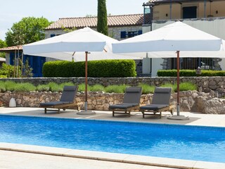 Sun beds around the pool