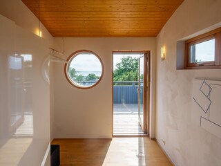 Bedroom 2 with porthole view of the horizon